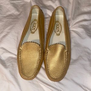Tod’s size 10 1/2 gold loafers